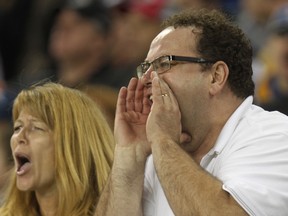 Winnipeg Blue Bomber fans yell at the officials during CFL action against the Hamilton Tiger-Cats at Investor Group Field in Winnipeg, Man., on Sat., Sept. 27, 2014. (Kevin King/Winnipeg Sun/QMI Agency)