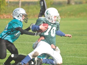 Leland Gabriel of the Portage Pitbulls crunchers team is tackled during a game Sept. 28. (Kevin Hirschfield/The Graphic)