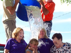 Members of the Mt. Elgin United Church do the Ice Bucket Challenge Sunday during the church's second annual ALS Walk. Left to right, Charlene Spector from ALS Canada, Sierra Dempsey, 9, Rev. Lynne Allin, and Dianne Ashford.
TARA BOWIE/SENTINEL-REVIEW