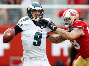 Philadelphia Eagles quarterback Nick Foles (9) is chased down by San Francisco 49ers linebacker Aaron Lynch (59) during the fourth quarter at Levi's Stadium. (Bob Stanton-USA TODAY Sports)