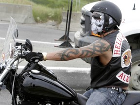 A motorcycle rider wearing Hells Angels' Alberta colours is stopped at a traffic light in this file photo. (JIM WELLS/QMI Agency Files)