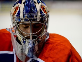 Edmonton Oilers goalie Richard Bachman #32 rests during an intermission during the second period of their NHL preseason game against the Chicago Blackhawks in Saskatoon, Saskatchewan, Sept 28, 2014. /QMI Agency