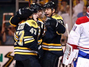 Boston Bruins right wing Jarome Iginla (12) celebrates his goal with teammates defenseman Torey Krug (47) and center David Krejci (46) as Montreal Canadiens goalie Carey Price (31) skates away during the second period in game seven of the second round of the 2014 Stanley Cup Playoffs at TD Garden. (Winslow Townson-USA TODAY Sports)