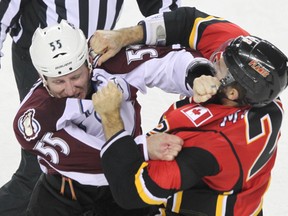 Colorado's Cody McLeod and Calgary's Lane MacDermid fight during NHL hockey action in Calgary, Alta. on Friday December 6, 2013. (Jim Wells/Calgary Sun/QMI Agency)