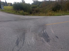 Marks are seen on the roadway at Dufferin County Rd. 10 at Mono-Amaranth Townline, the scene for a deadly collision. (TRACY McLAUGHLIN/Special to the Toronto Sun)