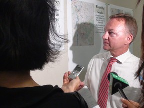 Mayoral candidate Mike Maguire explains to reporters his idea to use in-service and out-of-service rail corridors to run municipal commuter rail from the suburbs on Monday, Sept. 29, 2014. JON WILLING/OTTAWA SUN
