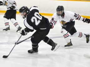 Jake Finlayson (26) of the Mitchell Hawks chases Liam Melady of the Goderich Flyers during action from their Western Jr. C regular season contest last Wednesday, Sept. 24. ANDY BADER/MITCHELL ADVOCATE