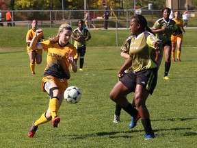 Cambrian's TK Rocca gets past a Centennial College defender during OCAA women's soccer action at the Cambrian pitch Saturday.