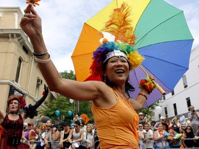 Olivia Chow, then an NDP MP, waves to the crowd along Yonge St. St. during the 2008 Pride Parade. (Toronto Sun files)