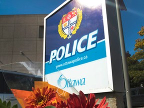 Someone left some flowers in front of police headquarters on Elgin Street Monday Sept 29,  2014. Staff Sgt. Kal Ghadban died Sunday after sources say he shot himself in his office.
Tony Caldwell/Ottawa Sun/QMI Agency