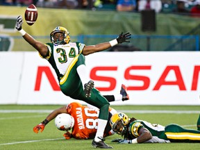 Ryan Hinds is seen reaching for a ball against the B.C. Lions recently. (Codie McLachlan, Edmonton Sun)