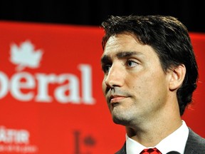 Liberal leader Justin Trudeau speaks to the media during the Federal Liberal summer caucus meetings in Edmonton August 20, 2014.  (REUTERS/Dan Riedlhuber)