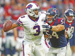 Buffalo Bills quarterback E.J. Manuel was battered by the Texans on Sunday and now is ego will be bruised after losing his job. (USA TODAY SPORTS)