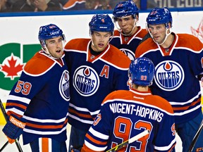 The Oilers celebrateTaylor Hall's goal during the second period of the Edmonton Oilers' NHL pre-season game against the Winnipeg Jets at Rexall Place in Edmonton, Alta., on Monday, Sept. 29, 2014. Codie McLachlan/Edmonton Sun/QMI Agency