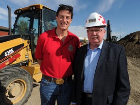 Brig-Gen. (ret.) Greg Matte, (L) national executive director of Helmets to Hardhats, stands with Neil Tidsbury, a member of the non-profit society's board of directors on Monday September 29, 2014 in northeast Calgary, Alta. The society, which has been in place for just over two years, aims to find jobs for soldiers leaving the Canadian Forces with industry.
Stuart Dryden/Calgary Sun/QMI Agency