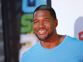 Former NFL player Michael Strahan poses at the 2014 Nickelodeon Kids' Choice Sports awards in Los Angeles July 17, 2014.  REUTERS/Danny Moloshok