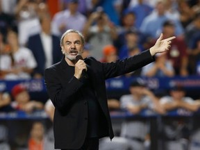 WASHINGTON, DC - JULY 04: Neil Diamond performs during A Capitol Fourth 2013 Independence Day Concert on the west lawn of the US Capitol on July 4, 2013 in Washington, DC.  Kris Connor/Getty Images for Capital Concerts/AFP