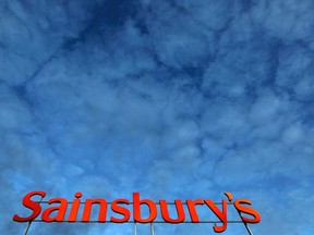 A Sainsbury's supermarket sign is seen in London in this January 11, 2012 file photo. (REUTERS/Stefan Wermuth)