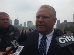 Mayoral candidate Doug Ford outside City Hall on Tuesday. (DON PEAT/Toronto Sun)