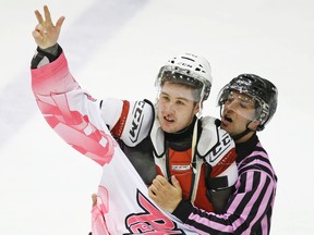 Peterborough Petes' Nick Ritchie gestures to the crowd following his scrap with Oshawa Generals' Hunter Smith on February 6, 2014 at the Memorial Centre. (Clifford Skarstedt/Peterborough Examiner/QMI Agency)