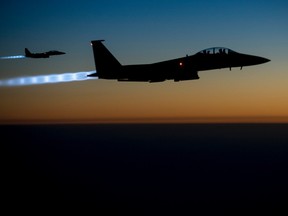A pair of U.S. Air Force F-15E Strike Eagles fly over northern Iraq after conducting airstrikes in Syria, in this U.S. Air Force handout photo taken early in the morning of September 23, 2014.

REUTERS/U.S. Air Force/Senior Airman Matthew Bruch/Handout