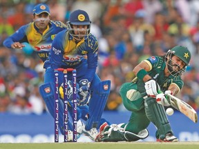 Pakistan’s Mohammad Hafeez (right) could be facing suspension for a suspect bowling action ahead the World Cup. (REUTERS)