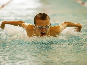 Ryan Boll of the Blue Dolphins swim team comes up for air while practicing his breast-stroke at the Allan & Jean Millar Centre.