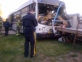St. Albert RCMP are investigating after a transit bus crashed into two residential fences, a trampoline and a back deck. Photo Supplied