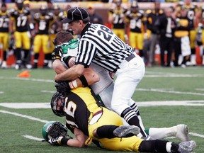 Andre Proulx's (above) CFL officiating crews have thrown the least number of flags per game on average this season. (Reuters)