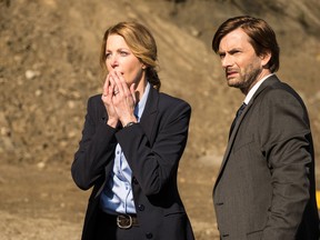 Detectives Miller (Anna Gunn, L) and Carver (David Tennant, R) arrive at the scene of a crime in the series premiere of Gracepoint.