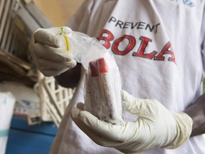 Blood samples from patients suspected of having the Ebola virus disease are prepared for transportation to Freetown for testing, at the Port Loko District Hospital September 27, 2014. (REUTERS/Christopher Black/WHO/Handout via Reuters)