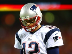 Tom Brady #12 of the New England Patriots on the sidelines during the game against the Kansas City Chiefs at Arrowhead Stadium on September 29, 2014 in Kansas City, Missouri.  (Dilip Vishwanat/Getty Images/AFP)