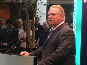 Doug Ford pledges to cut the Toronto land transfer by 15% next year at the Toronto Real Estate Board on Wednesday, October 1, 2014. (Don Peat/Toronto Sun)