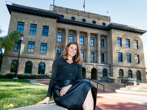 Emma May mugs for a photo outside of the McDougall Centre in Calgary, Alta., on Wednesday, Oct. 1, 2014. May is the newly appointed executive director of the premier's southern Alberta office. Lyle Aspinall/Calgary Sun/QMI Agency