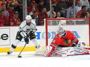 Los Angeles Kings right winger Justin Williams attempts a wrap around shot on Chicago Blackhawks goalie Corey Crawford during the Game 2 of the Western Conference Final of the 2014 playoffs at the United Center on May 21, 2014. (Dennis Wierzbicki/USA TODAY Sports)