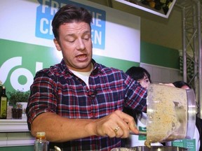 Celebrity chef Jamie Oliver teaches a group of students how to cook using fresh ingredients at an event partnered with Sobeys and Free the Children on Wednesday, Oct. 1, 2014. (Veronica Henri/Toronto Sun)