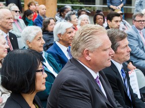 Toronto mayoral candidates Olivia Chow (from left), Doug Ford and John Tory during the CARP flag raising ceremony in honour of National Seniors Day at Toronto City Hall Wednesday October 1, 2014. (Ernest Doroszuk/Toronto Sun)