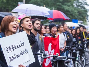 Hundreds of demonstrators in support of Hong Kong democracy in front of the Hong Kong Economic and Trade Office in Toronto on Wednesday, October 1, 2014. (Ernest Doroszuk/Toronto Sun)