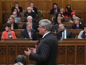 Canada's Prime Minister Stephen Harper speaks during Question Period in the House of Commons on Parliament Hill in Ottawa October 1, 2014.