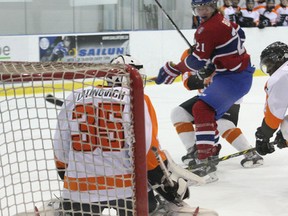 Kingston Voyageurs forward Cole Bolton watches his shot go wide of Orangeville Flyers goalie Nicholas Latinovich during the Voyageurs’ Ontario Junior Hockey League season opener at the Invista Centre on Sept. 14. (IAN MACALPINE/THE WHIG-STANDARD)