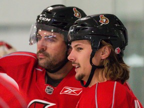 Ottawa Senators defenceman Chris Phillips and Erik Karlsson. (Errol McGihon/Ottawa Sun)