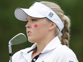 Brooke Henderson watches her shot during the final round of the World Junior Girls Golf Championship at Angus Glen on Wednesday. (Craig Robertson/Toronto Sun)