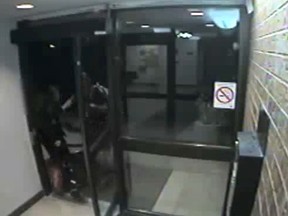 A video still of a 91-year-old woman being robbed of her purse. (Toronto Police handout)