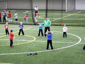 Woodstock Minor Baseball Association minor rookie ball players practise throwing drills at Cowan Park. (File photo)