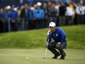 Rory McIlroy of Northern Ireland lines up a putt on the 10th green during Sunday's singles matches on the final day of the Ryder Cup in Gleneagles, Scotland, on September 28, 2014. (AFP PHOTO/ADRIAN DENNIS)