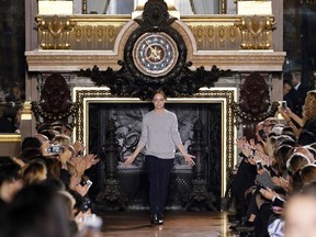 British fashion designer Stella McCartney acknowledges the public at the end of her 2015 Spring/Summer ready-to-wear collection fashion show, on September 29, 2014 in Paris.  AFP PHOTO/PATRICK KOVARIK