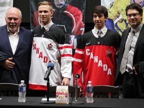 Sarnia Sting players Jakob Chychrun, in white, and Jordan Kyrou have been named to one of three Canadian national teams in this year's World Under-17 Hockey Challenge in Sarnia-Lambton. They're pictured with Ontario Hockey League Commissioner David Branch, and Ryan Jankowski, Hockey Canada's head scout of men's national teams. TYLER KULA/ THE OBSERVER/ QMI AGENCY