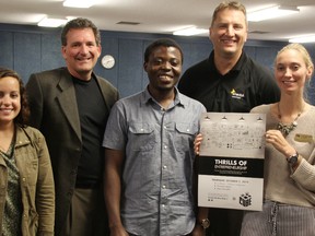 Students and staff involved with Lambton College's new entrepreneurship project, the Cube, pose at the college with a poster highlighting the initiative's kick-off celebration Oct. 2. From left are Cube employee and business owner Amanda DaSilva, Enactus Lambton faculty advisor Jon Milos, photography student and business owner Bisi Alawode, Student Services Executive Director Rob Kardas, and Entrepreneurship Officer Anja Christensen. TYLER KULA/ THE OBSERVER/ QMI AGENCY