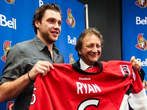 Ottawa Senators team owner Eugene Melnyk poses for photos with forward Bobby Ryan during a press conference at the Canadian Tire Centre on Thursday. Ryan has signed a 7 year contract extension. (Errol McGihon/Ottawa Sun)