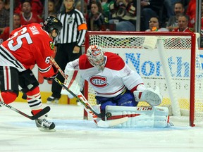 Montreal Canadiens goalie Carey Price (31) makes a save on a shot from Chicago Blackhawks center Andrew Shaw (65) during the first period at the United Center. (Dennis Wierzbicki-USA TODAY Sports)